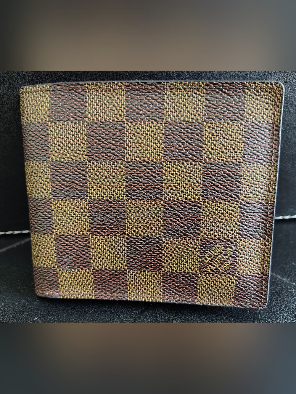 VINTAGE LOUIS VUITTON DAMIER EBENE CANVAS BI-FOLD WALLET WITH TAG.